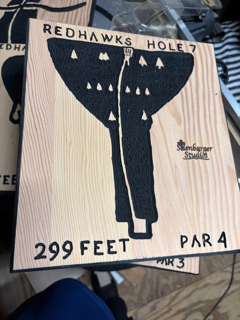 Redhawks disc golf hole carved sign