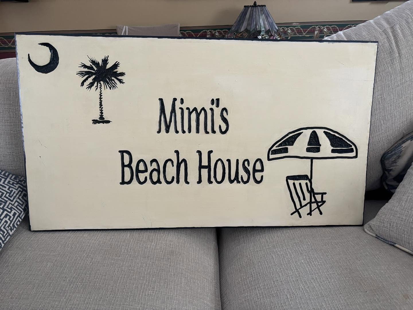 Mimi's Beach House carved sign with palmetto and umbrella