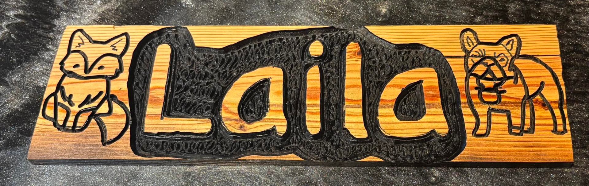 Laila carved name sign with fox and bulldog