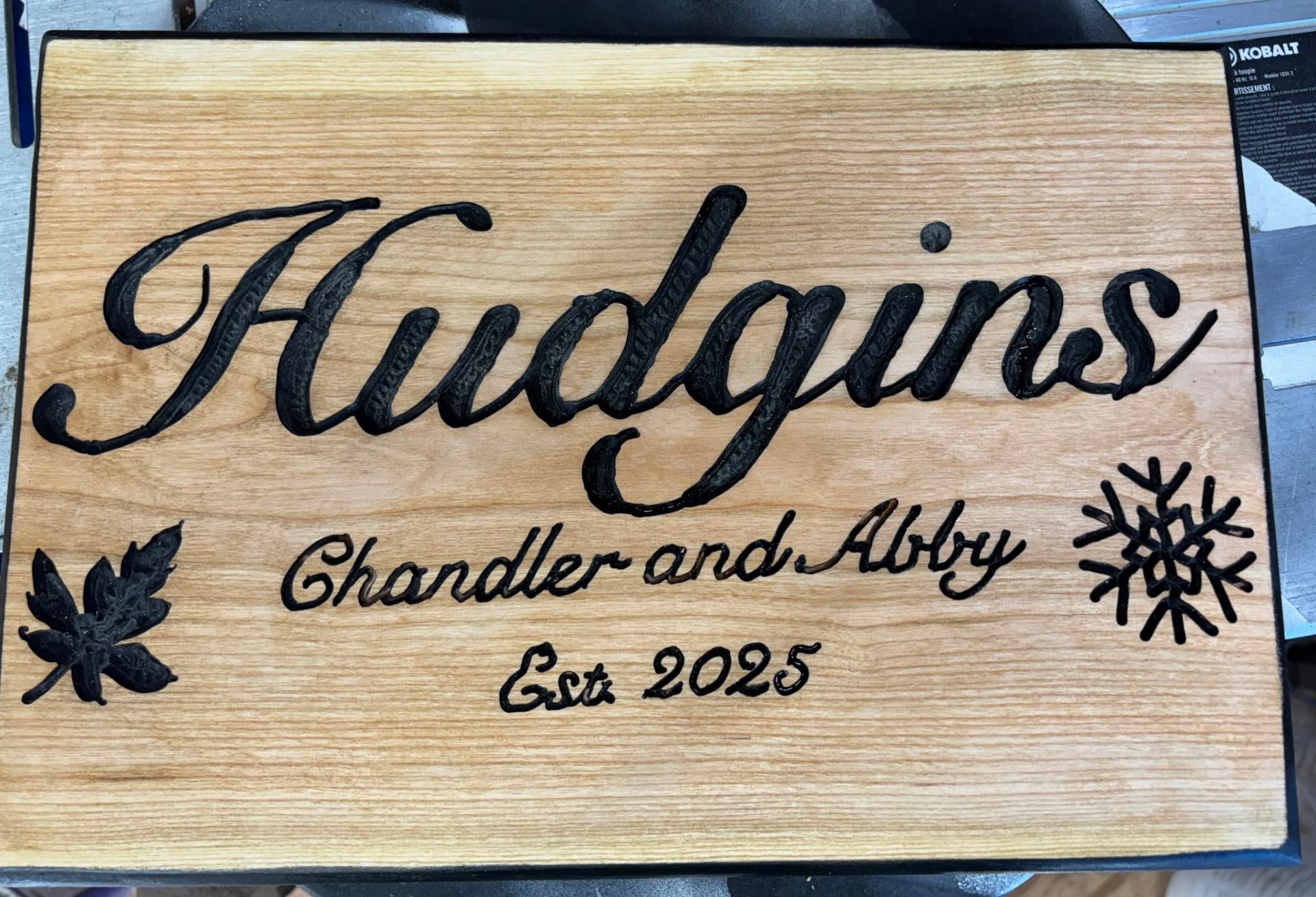 Hudgins family name carved wood sign